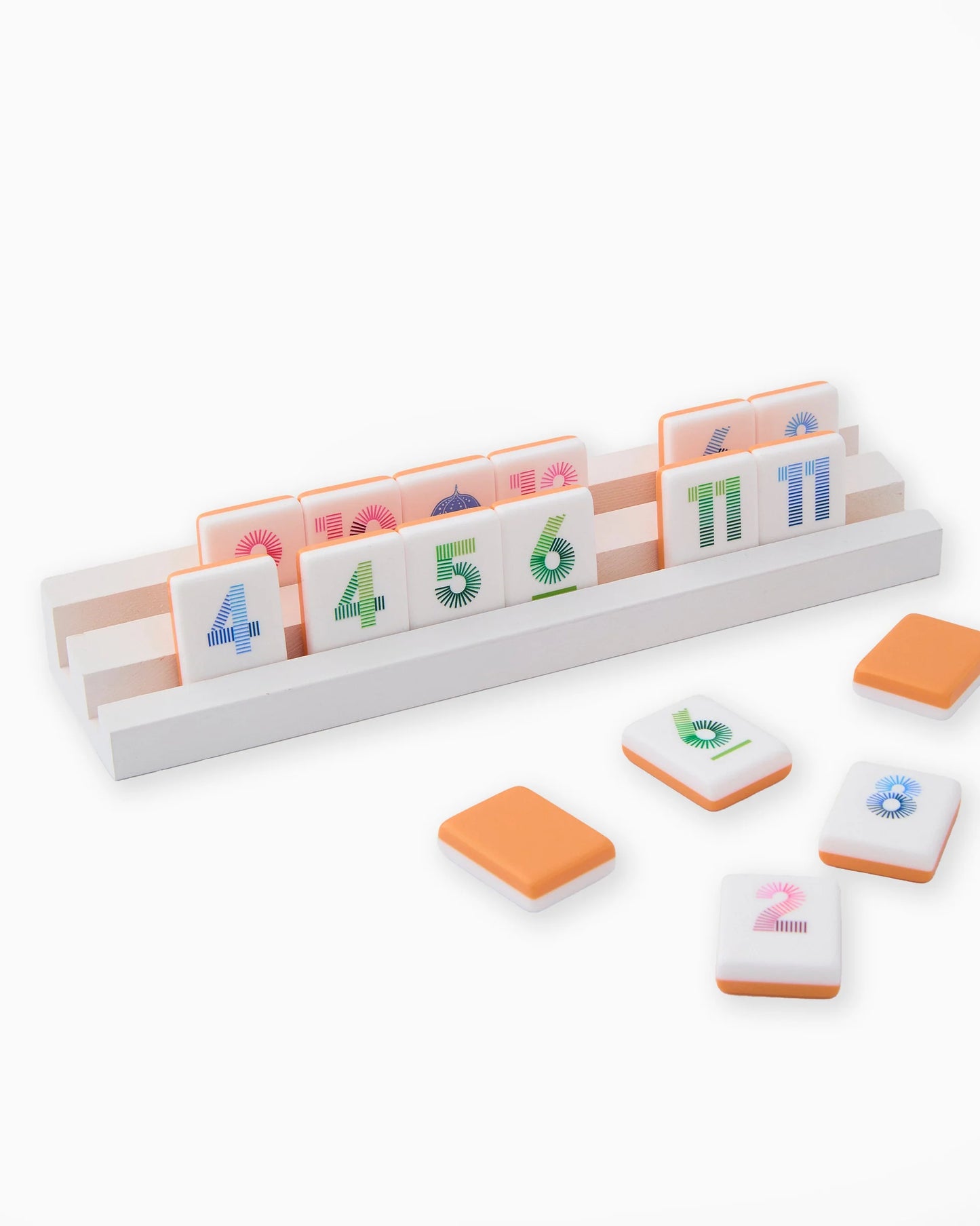 Oh My Mahjong Orange Rummi tile set on white wooden racks