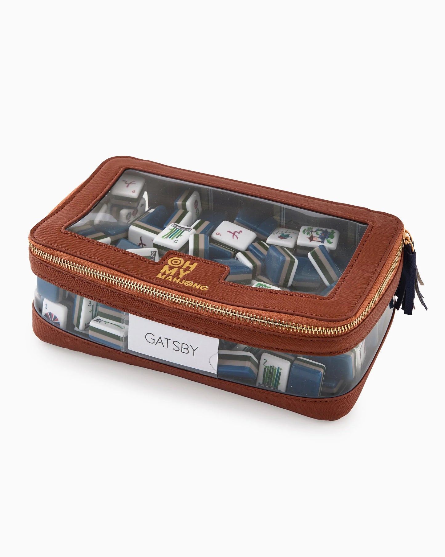 Oh My Mahjong stacking tile storage bag in cognac brown with plaid interior that coordinates with Astor Mat, with blue tasseled zipper with Gatsby mahjong tiles.