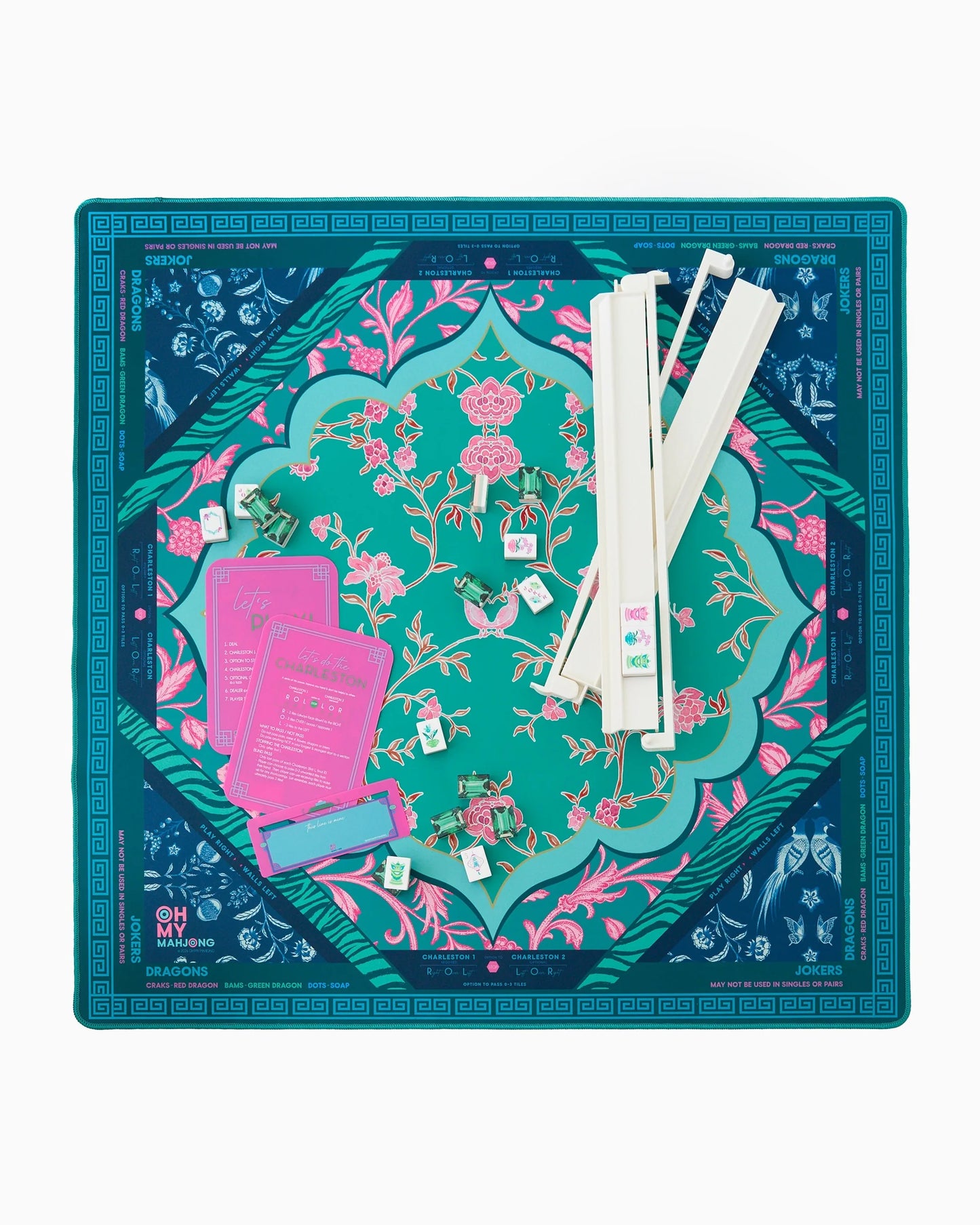 Oh My Mahjong Esme  instructional mahjong mat in emerald green, teal, navy blue floral and animal print pattern with mahjong accessories, racks, shuffler, line finder and emerald mahjong tiles